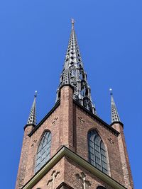 Low angle view of building against blue sky