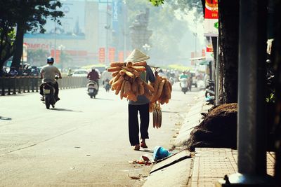 Woman walking on road