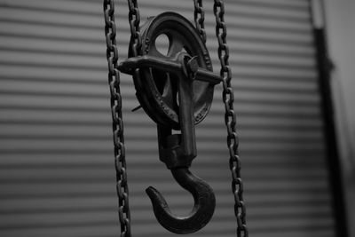 Close-up of chain hanging on rope