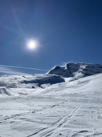 Scenic view of a ski slope with a clear sky