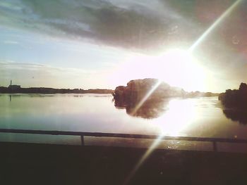 Scenic view of lake at sunset