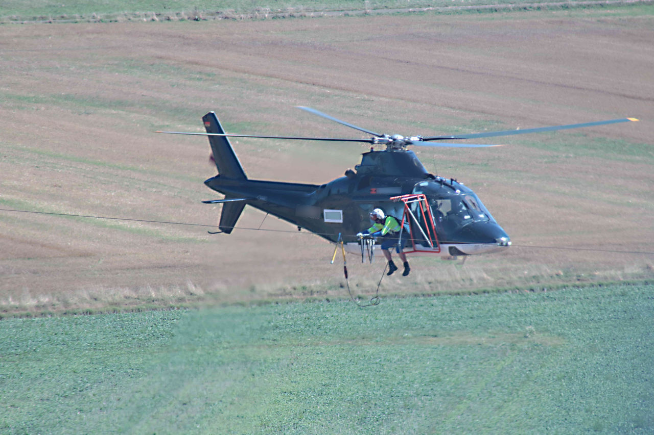 AIRPLANE FLYING IN FIELD