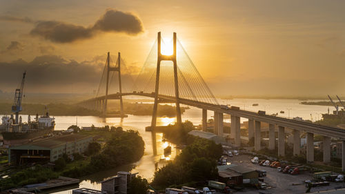 Phu my bridge over sea against sky during sunset in ho chi minh city, vietnam