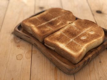 High angle view of bread on cutting board