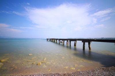 Pier over sea against sky