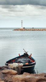 Boat in sea against sky