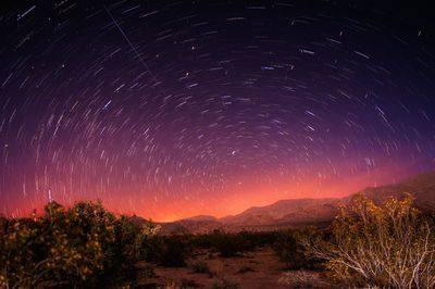 Scenic view of landscape against sky at night