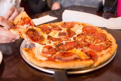 Close-up of pizza on table in restaurant