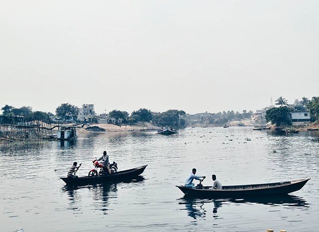 nautical vessel, transportation, water, mode of transport, boat, lifestyles, men, clear sky, waterfront, leisure activity, river, sailing, moored, travel, lake, copy space, sitting, nature