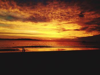 Scenic view of sea against orange sky