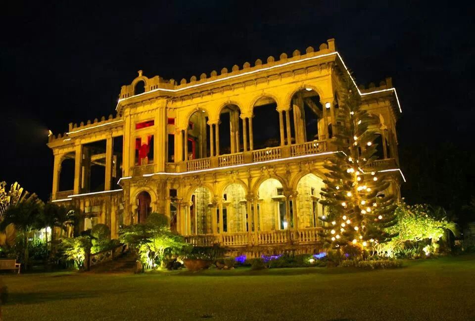 architecture, building exterior, built structure, night, illuminated, facade, history, low angle view, famous place, travel destinations, sky, tree, city, place of worship, religion, exterior, travel, tourism, lawn, outdoors