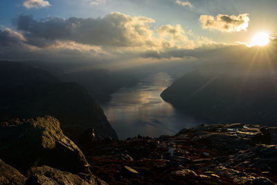 Scenic view of rocks against sky during sunset