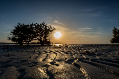 Scenic view of beach against sky during sunset