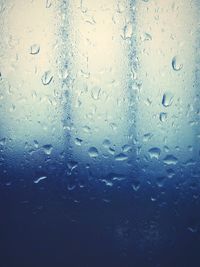 Close-up of water drops on glass