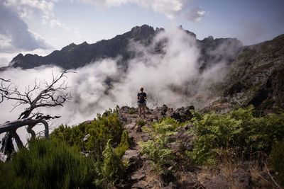 Panoramic view of waterfall against sky