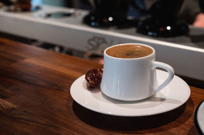 Close-up of coffee served on table