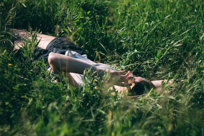 Woman lying on grass