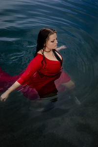 Young woman swimming in sea