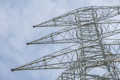 Low angle view of communications tower against sky