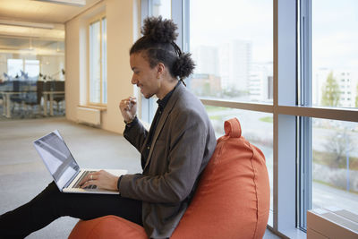 Man in office using laptop