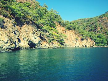 Scenic view of sea with mountains in background