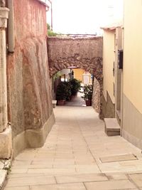 Walkway amidst buildings