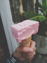 Cropped hand holding ice cream