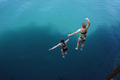 Full length of man jumping in sea