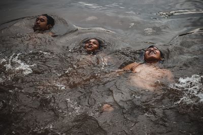 High angle view of boys swimming in pool