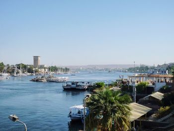 Boats on nile river against clear sky