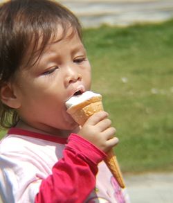 Close-up of boy eating ice cream