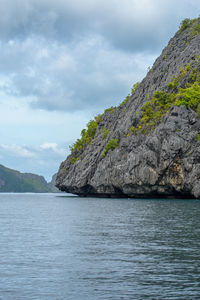 Photo showcases the stunningly rugged coastline of the philippines. a series of rocky outcroppings.