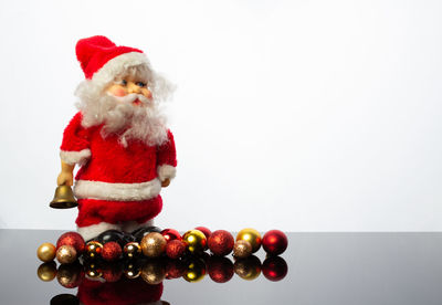 Close-up of christmas decorations over white background