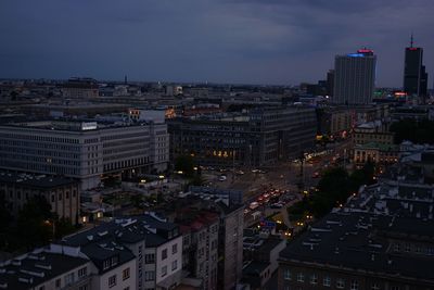 High angle view of illuminated buildings in city at dusk