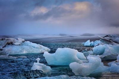 Scenic view of frozen sea against sky