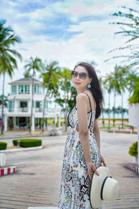 Portrait of young woman standing outdoors