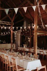 Empty chairs and tables in restaurant