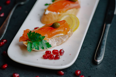 High angle view of fish in plate on table