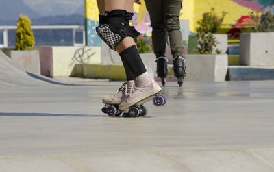 Low section of man skateboarding on skateboard