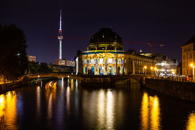 Illuminated buildings in city at night