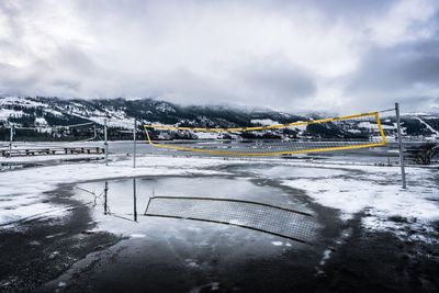 Scenic view of frozen lake against sky