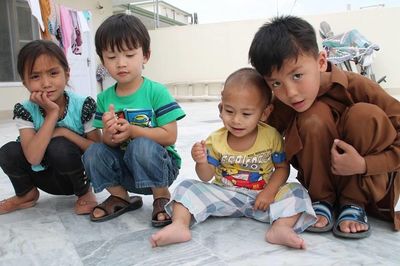 High angle view of friends sitting on floor