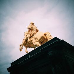 Low angle view of statue against sky