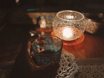 Close-up of hand holding glass