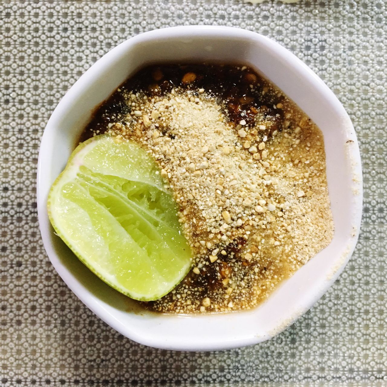 CLOSE-UP OF SOUP IN GLASS ON TABLE