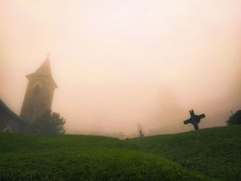 Church and its garden in a foggy day.