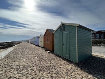 Beach huts against sky