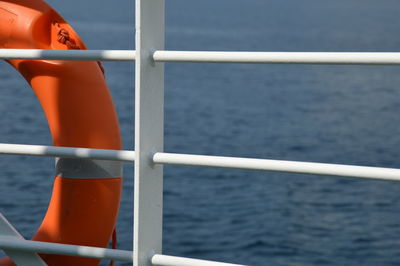 Close-up of buoy on railing