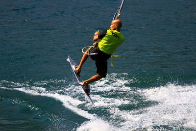 Full length of man surfing on sea