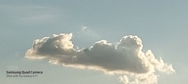 Low angle view of sign against sky